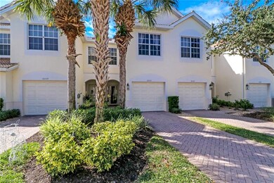 Front of home with paver driveway, attached garage