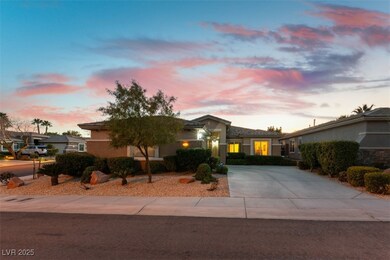 Ranch-style house featuring driveway and stucco si