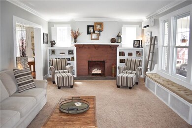 Living room with gas fireplace, built-in book shel