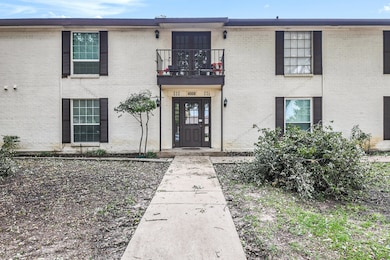 Doorway to property featuring brick siding