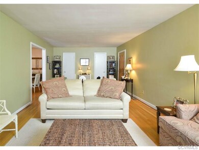 This view of the living room shows both coat close