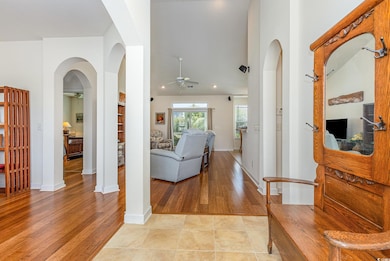 Corridor with light wood-style flooring, recessed 