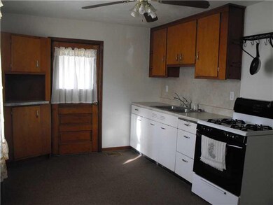 Kitchen. Newer carpeting and newer counters, sink 