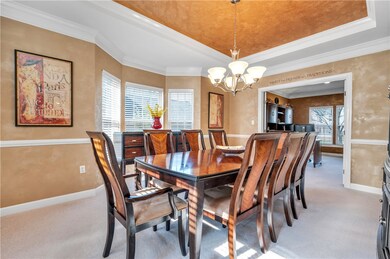Generous formal dining room with dramatic tray cei