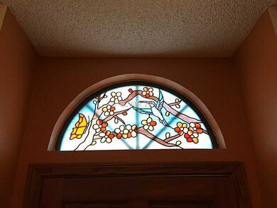 Property Photo. Stained Glass over Entry Door