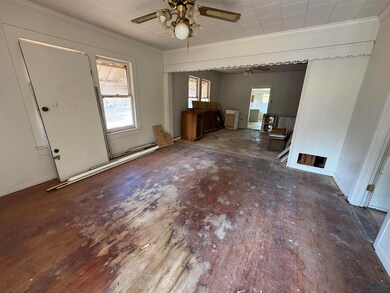 Unfurnished living room with dark hardwood / wood-