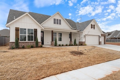 Modern inspired farmhouse featuring brick siding, 
