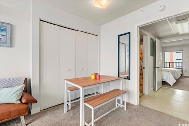 Dining area with light carpet