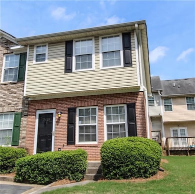 Multi unit property featuring brick siding and a d