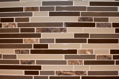 Close up view of glass backsplash.