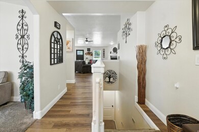 Corridor with wood finished floors and baseboards