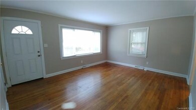Living room has beautiful wood floors and lots of 
