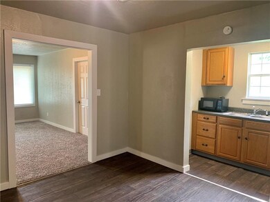 View from dining room into kitchen area and living