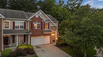 View of front facade featuring driveway, an attach