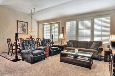 The entry hall leads to a spacious living room and