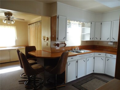 Kitchen has freshly painted cabinets and nice dini