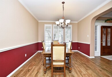 The formal dining room is immediately to the right of the foyer and can easily accommodate upcoming holiday festivities. Bright and cheerful, the wall of 3.5