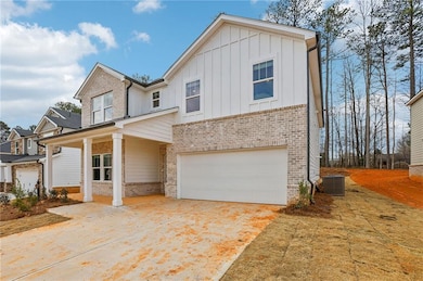 View of front of property featuring board and batt
