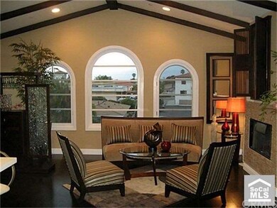 spacious great room with fireplace and ocean views