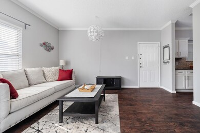 Living area with wood finished floors, ornamental