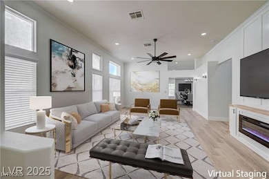 Living area featuring light wood-style floors, rec