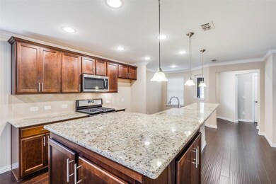 Kitchen featuring gas stove, crown molding, tastef