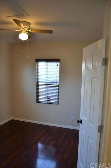 ! bedroom with walk in closet, new flooring, fresh