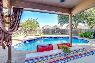 View of pool with a fenced backyard,  and a patio