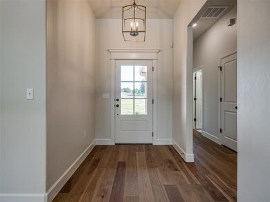 Entrance foyer featuring a notable chandelier and 