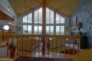 View Into Living Room w/Wall of Windows