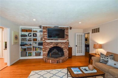 Family room with built ins and wood burning firepl