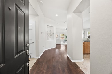 Step inside to a bright, open layout with rich flooring, fresh interior paint, and thoughtful architectural touches. This welcoming entryway sets the tone for easy, connected living throughout the home.