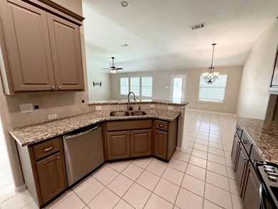 Kitchen featuring dishwasher, a peninsula, ceilin
