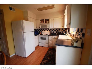 Kitchen - Kitchen with a tile backsplash and pantr