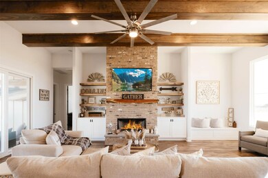 Living room featuring ceiling fan, recessed light