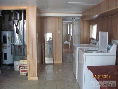 Undefined: Laundry area in lower level of home.
