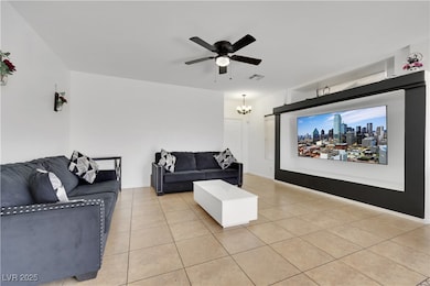 Living room with light tile patterned flooring, ce