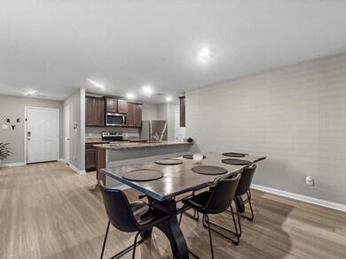 The kitchen flows into the very spacious dining room. Perfect for a large table to fit lots of friends and family.