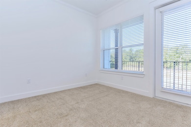 Large living room with natural light opens to priv