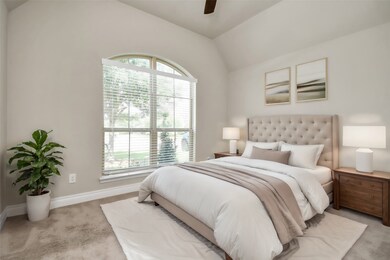 This cozy bedroom is perfect for guests or family members, offering a comfortable and stylish space with ample natural light. The neutral decor and plush carpeting provide a warm and welcoming environment.