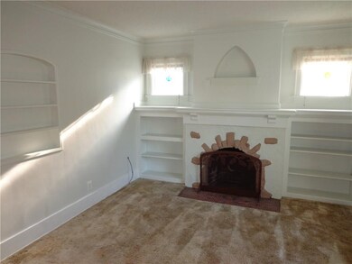 The Living Room features a wood burning fireplace 