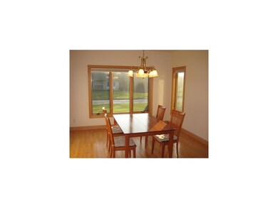 Dining Area. Hardwood flooring, lots of windows an