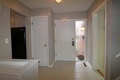 Foyer with ceramic tile floor