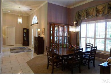 Enter into 12 ft ceilings in main living area with crown molding, and plantation shutters