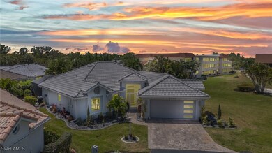 View of front of house featuring a lawn, a tile ro