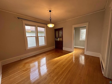 Unfurnished dining area with ornamental molding, l