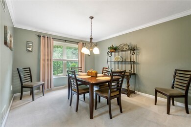 Dining room overlooks the lush backyard