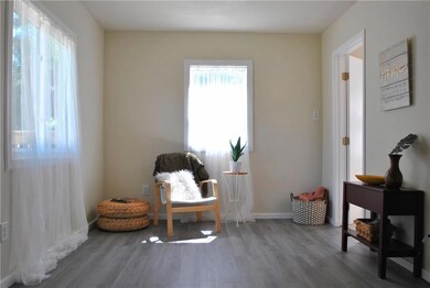 Spacious living room with lots of natural light. N