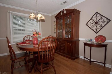 The charming dining room receives lovely natural light.
