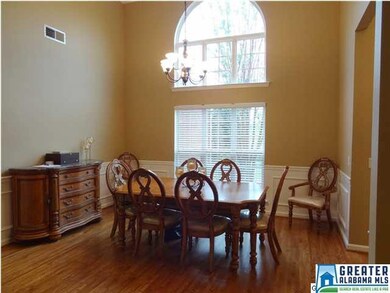 Elegant formal dining room with palladium window a